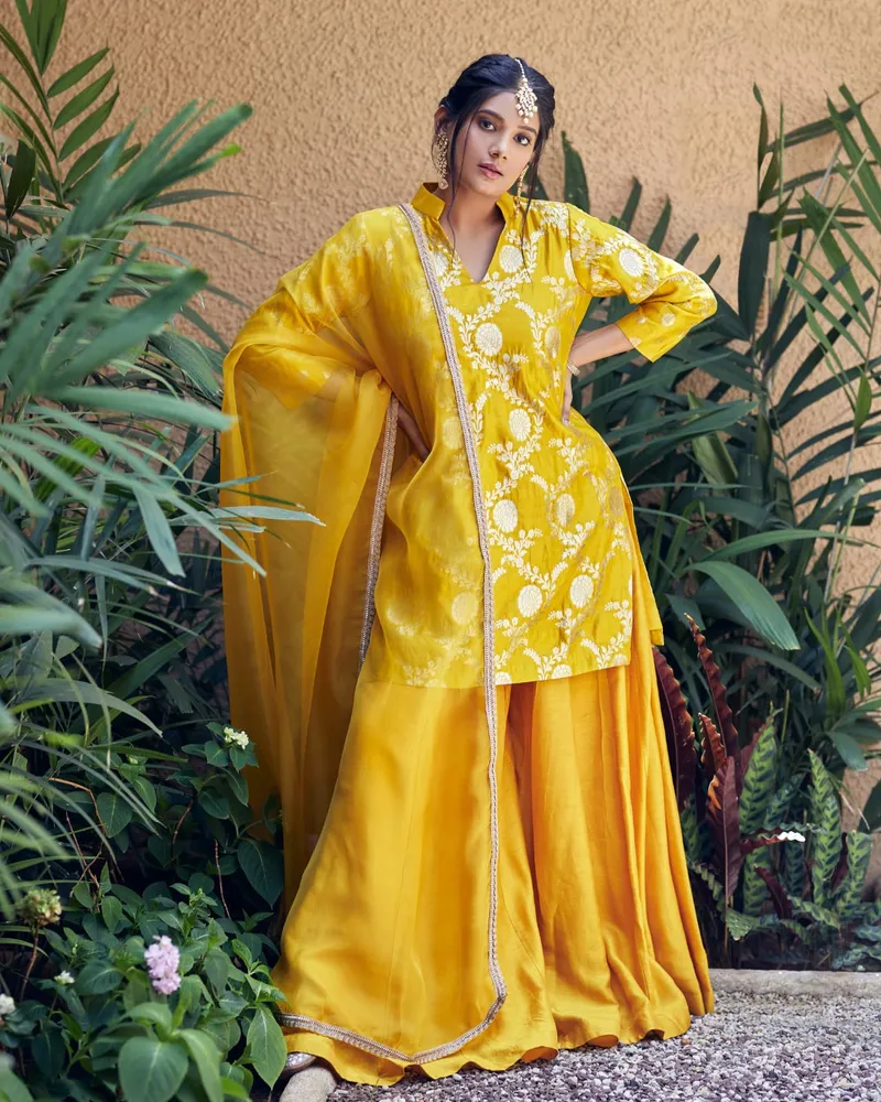 Snehal Patil in a yellow outfit with a sheer dupatta