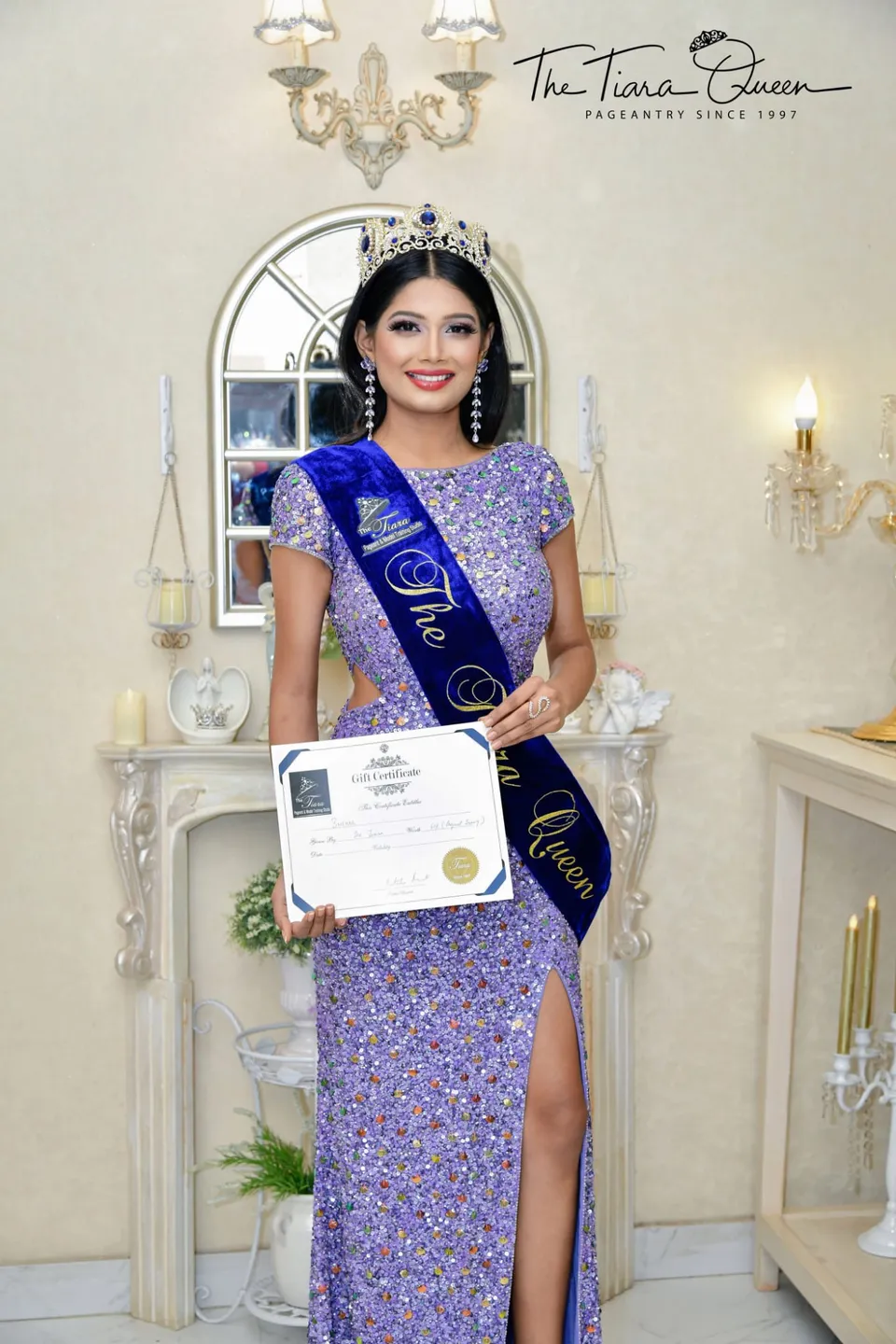 Snehal Patil crowned, wearing a sash reading “The Tiara Queen” and holding a certificate